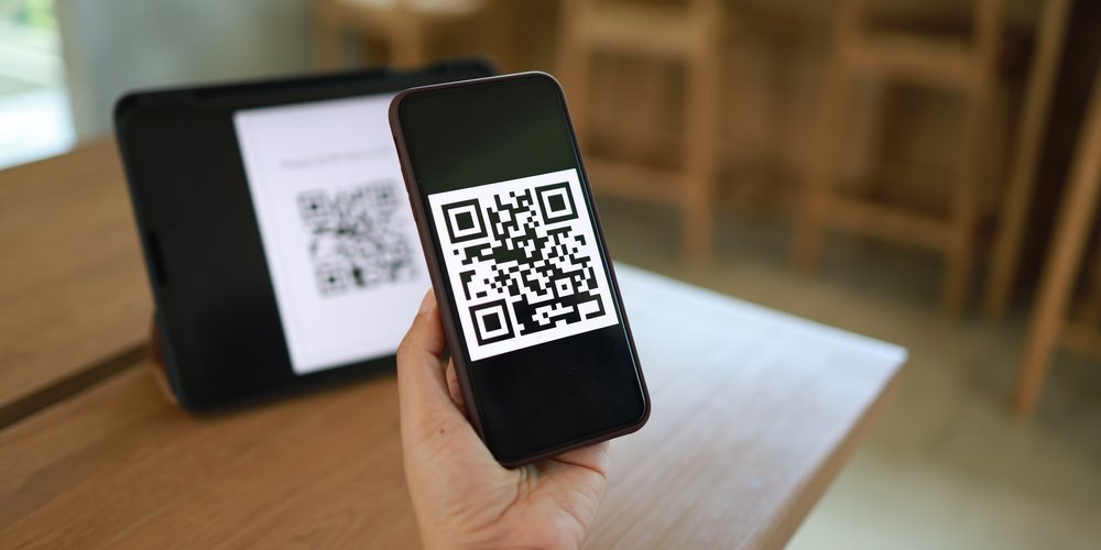 Use QR codes at community event booths for nonprofit marketing